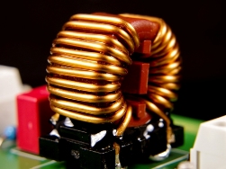 Inductor to protect against common mode noise generated by a switching power supply